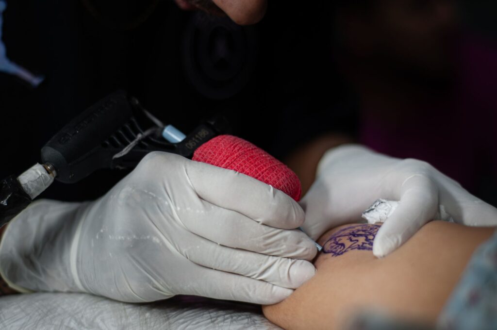 Close-up view of a completed tattoo showing intricate line work and shading
