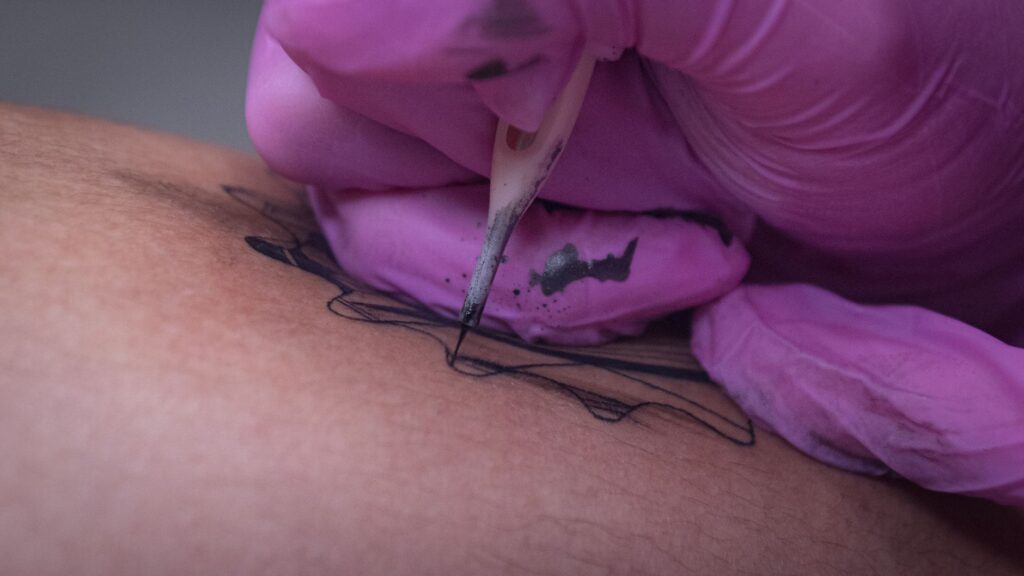 Close-up of intricate tattoo details showing precision craftsmanship