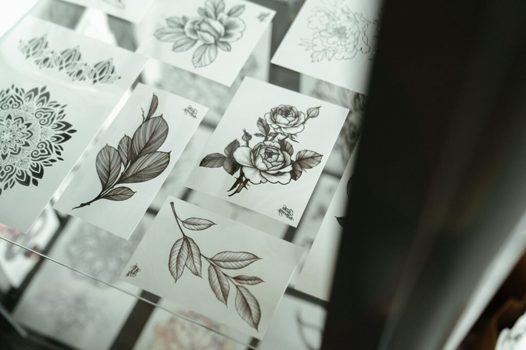 Selection of finished tattoos showcasing various artistic styles and techniques