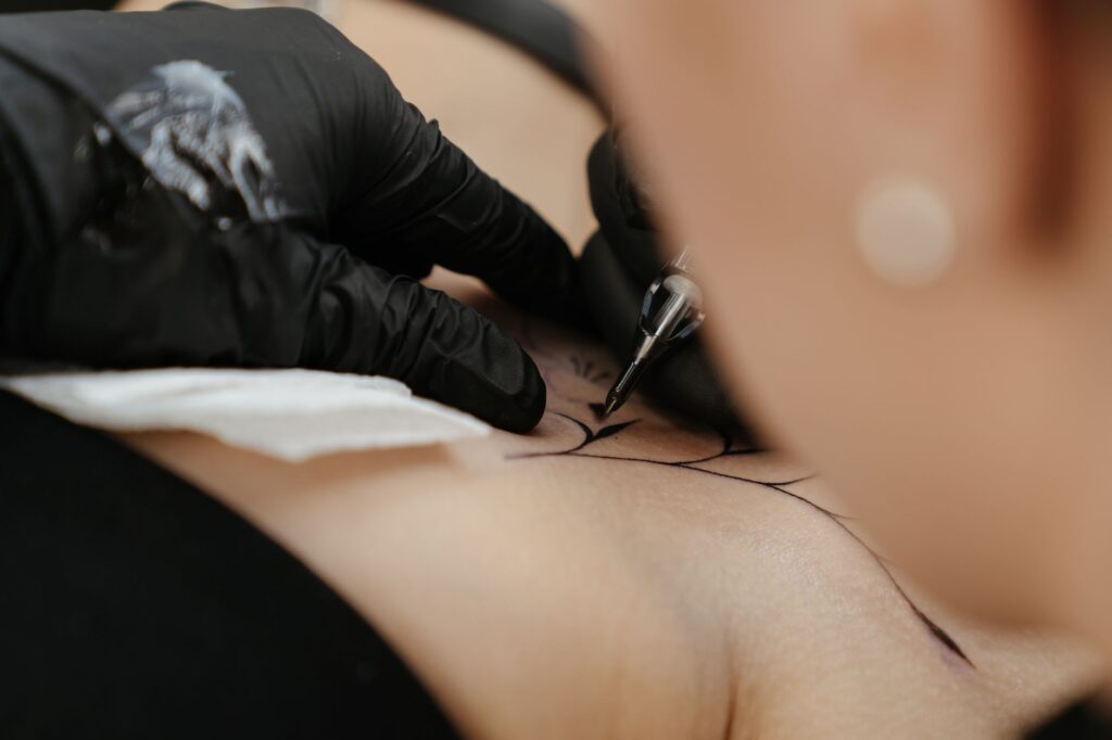 Black ink tattoo featuring detailed shading and fine line work